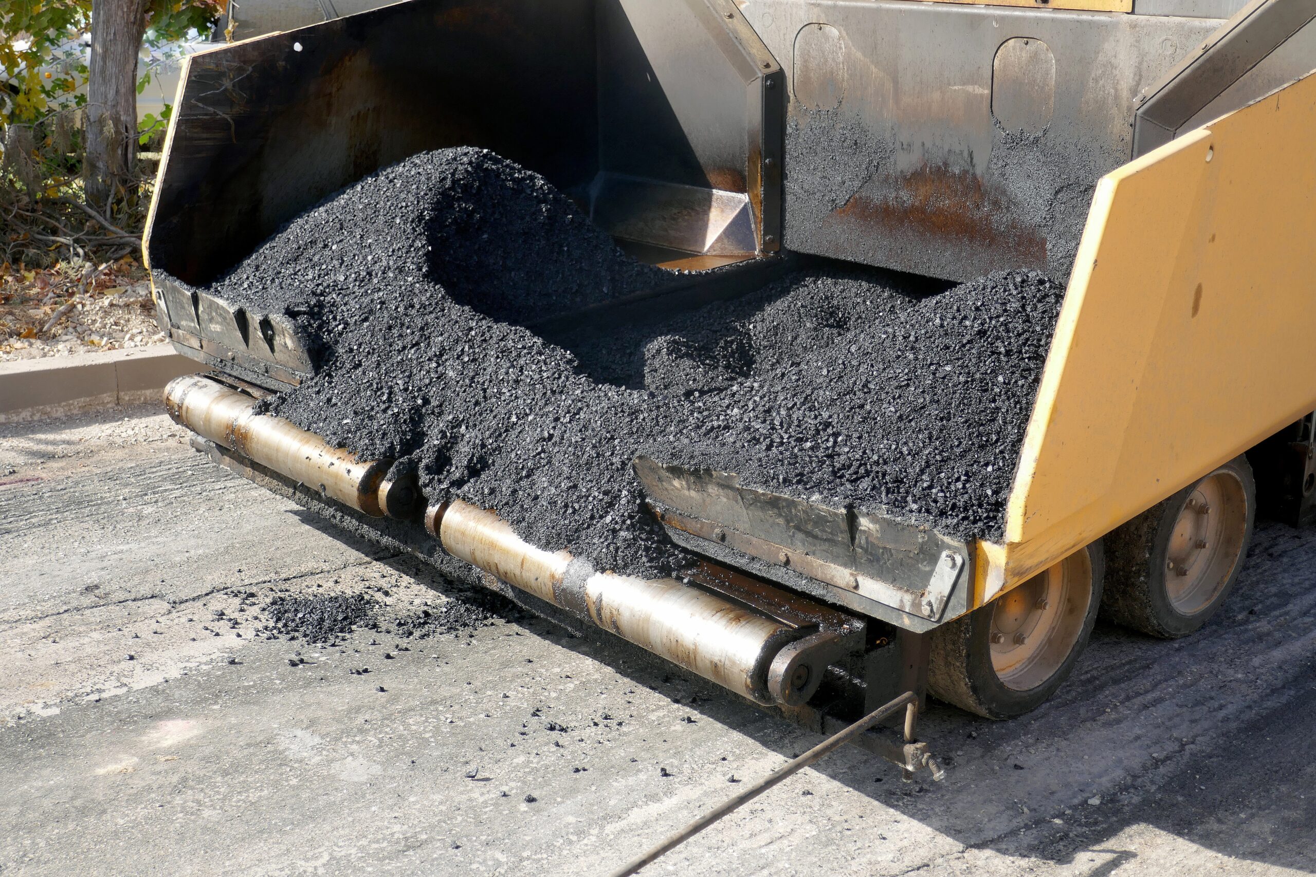 A,Paving,Machine,Placing,Fresh,Asphalt,Or,Bitumen,On,A